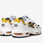 Air Max 96 II sneakers The Nike Air Max 96 II feature a white, black, and 'Midnight Navy' colour combination. First, the pair features navy mesh on the upper while white leather adorns the overlays. Following a 'Golden Yellow' around the Swoosh, running across the sides, and tongue branding. Finishing the look, white colour appears on the midsole and black on the rubber outsole.