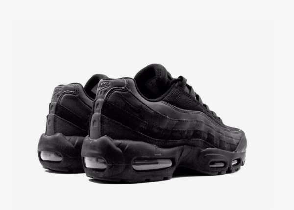 Nike Air Max 95 Essential "Triple Black" sneakers The Nike Air Max 95 Essential is inspired by the human body. The midsole represents the spine, graduated panels are the muscles, the lace loops are the shoe's ribs and the mesh on the upper is the skin. Highlights  black  leather  signature Swoosh logo detail  round toe  front lace-up fastening  logo patch at the tongue  branded insole  rubber sole with Max Air cushioning  These styles are supplied by a premium sneaker marketplace. Stocking only the most sought-after footwear, they source and curate some of the most hard to find sneakers from around the world.
